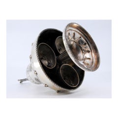 Silver altar bell w/ bows, cords & topped w/ a radiant cross, mechanism inside