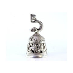 Silver altar bell with cut-out reliefs and dolphin-shaped knob
