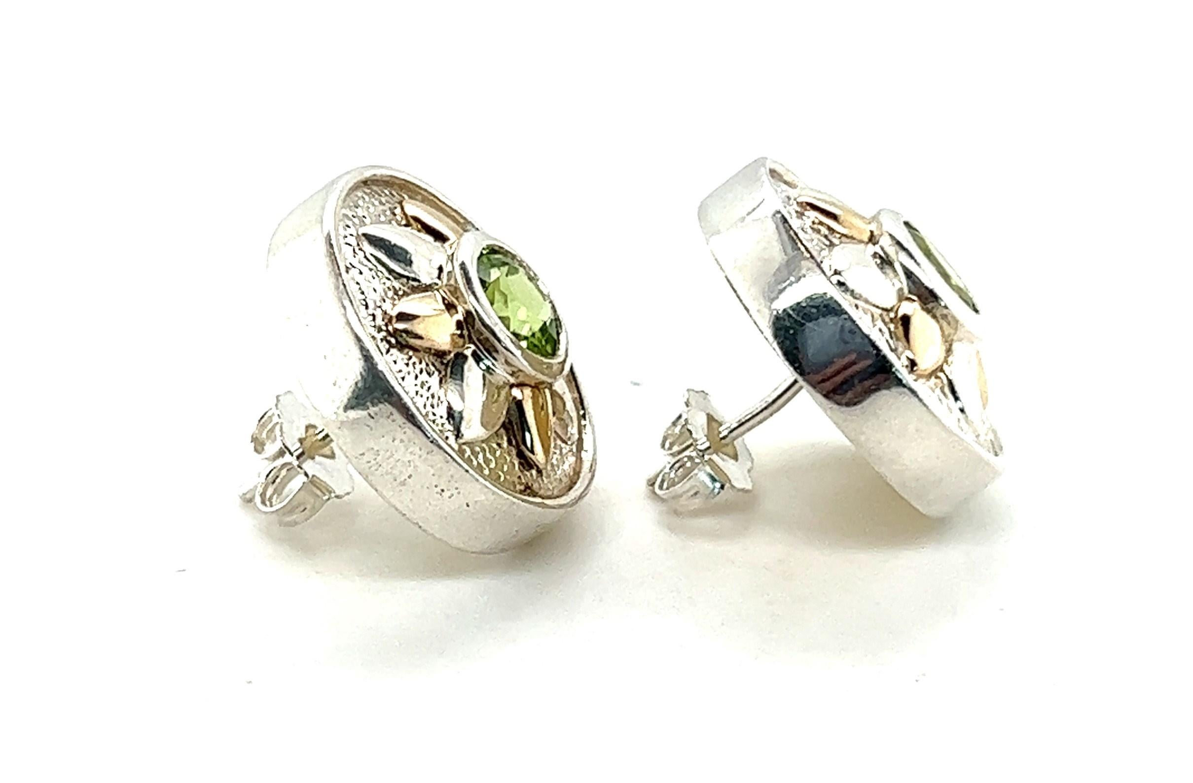 What do you get the August baby who has everything? These earrings, of course!

Sterling Silver and 14kt yellow gold stud earrings shaped like a circle with alternating silver and gold flower petals surrounding a bezel set peridot in the center. The