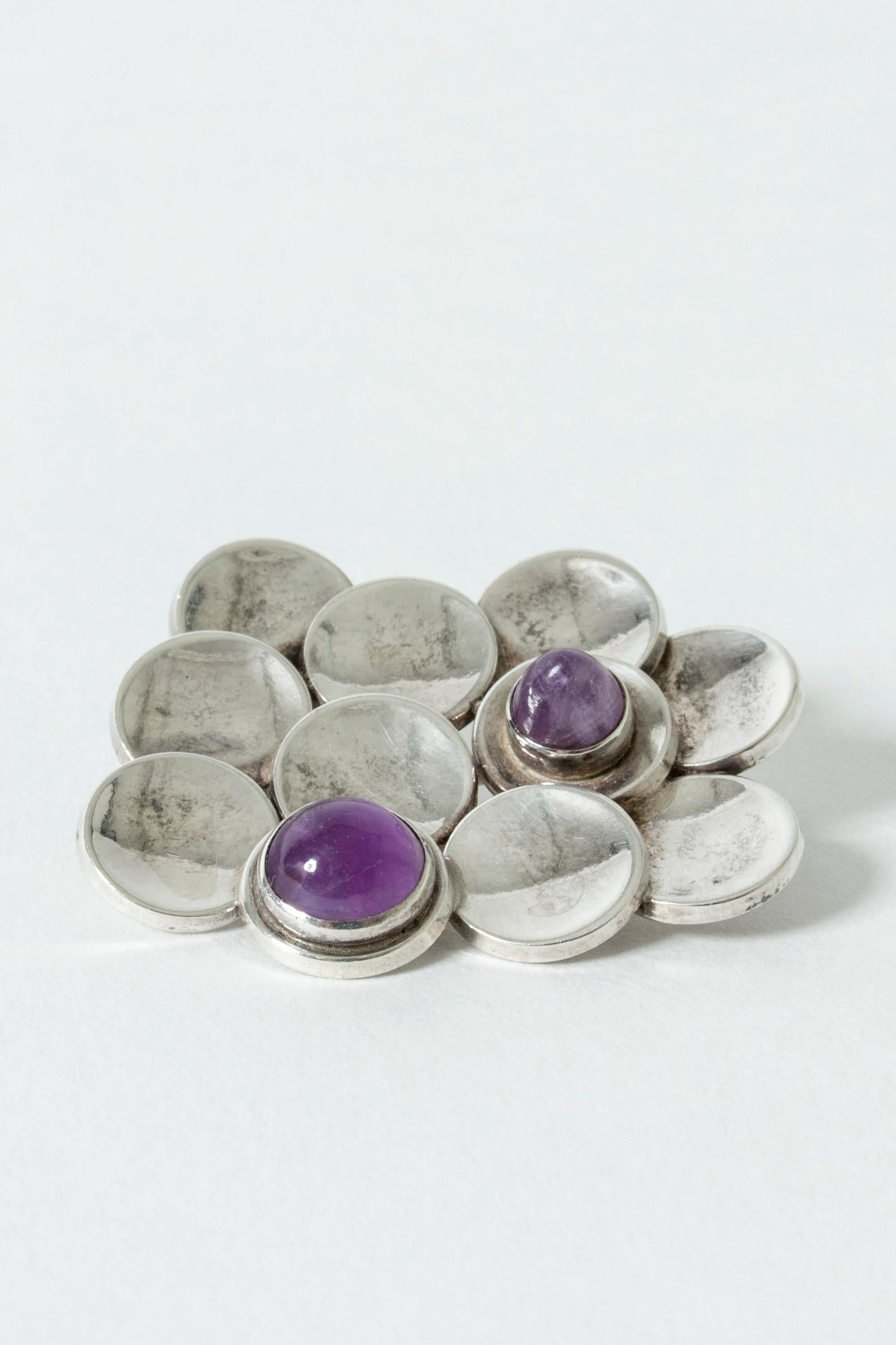 Lovely silver brooch from Victor Jansson, with two amethyst stones. Made from concave spheres in an appealing, cloud-like design.