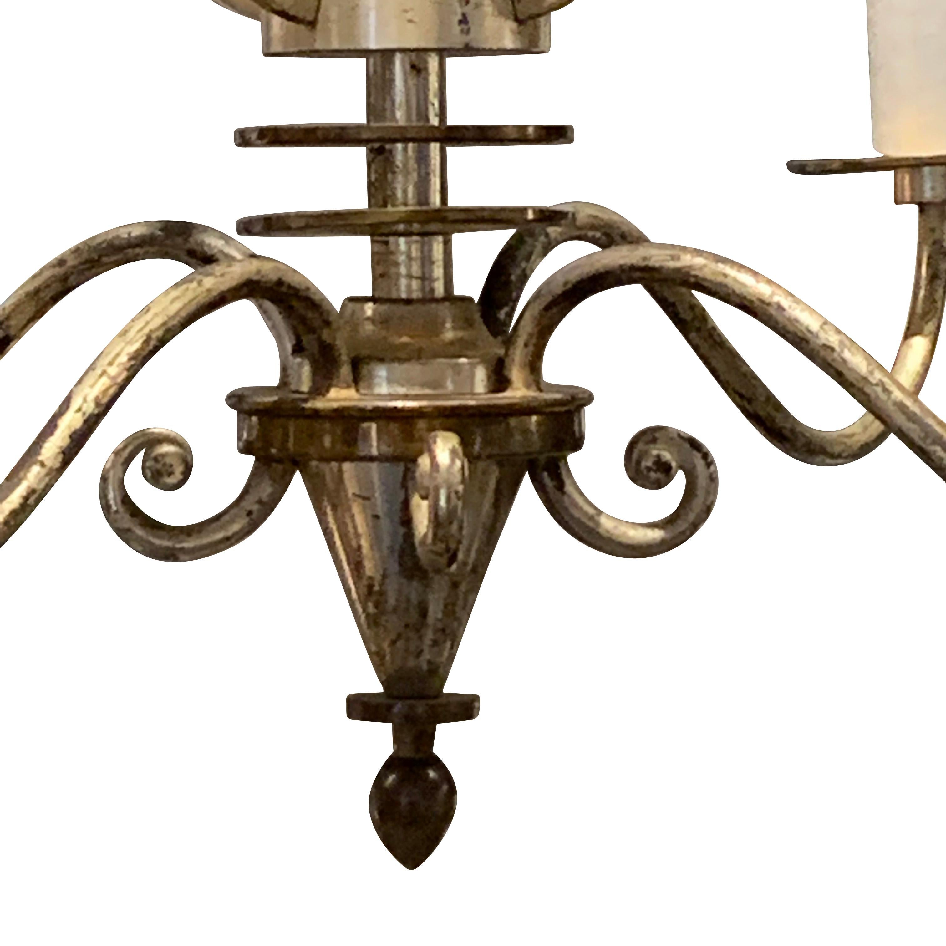 1940s French silver and bronze four arm chandelier.
Decorative harp design center column.
Newly rewired
Candelabra bulbs
Fixture height only 19