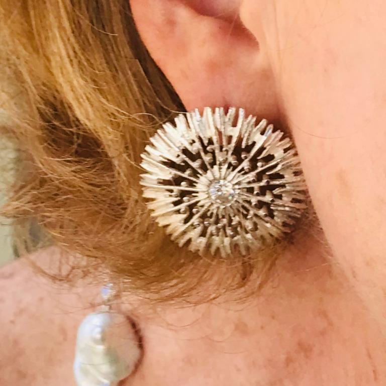 Sophisticated silver filigree earrings in 18 carat white gold with diamond centre detail. Please note this item is made to order and a similar but not identical piece can be made. Allow four weeks to delivery. 

Esther Eyre has been designing and