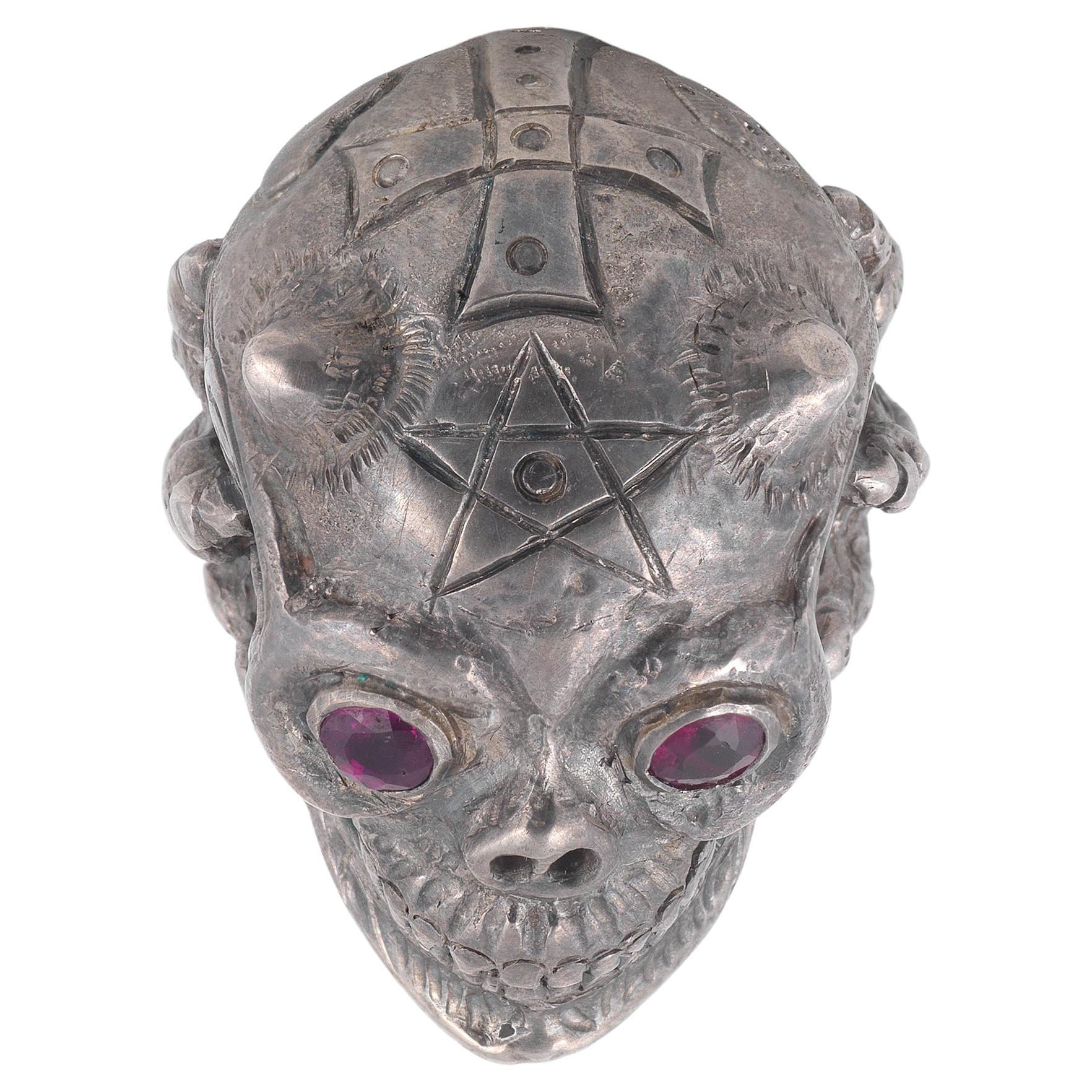 Silver Devil Magical Skull with cross and star david on the top, garnet eyes 
Size : 8 1/4 
Weight : 42.9gr