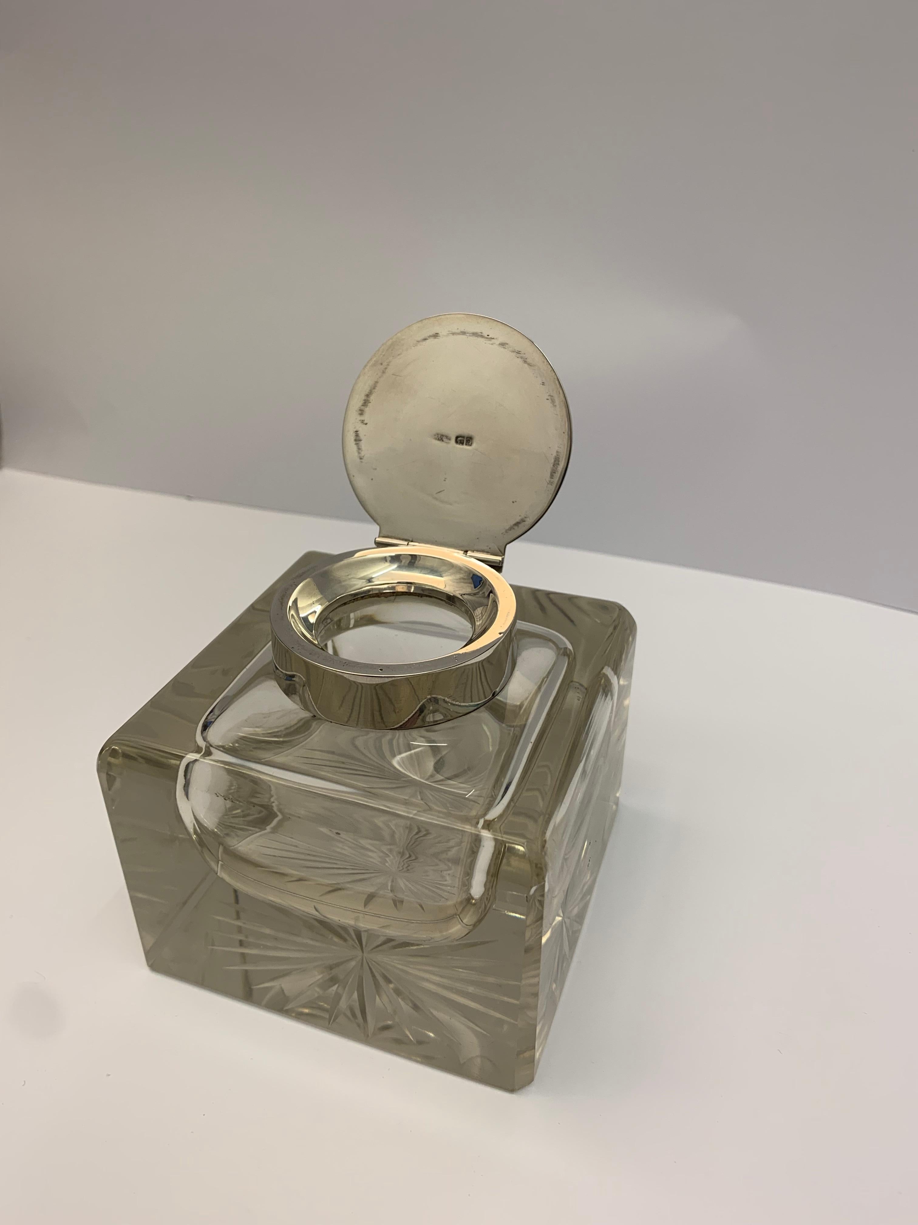 A solid square silver and glass Inkwell, Made in London, 1913.