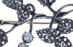Silver and Gold brooch with diamonds.