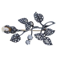Silver and Gold brooch with diamonds.