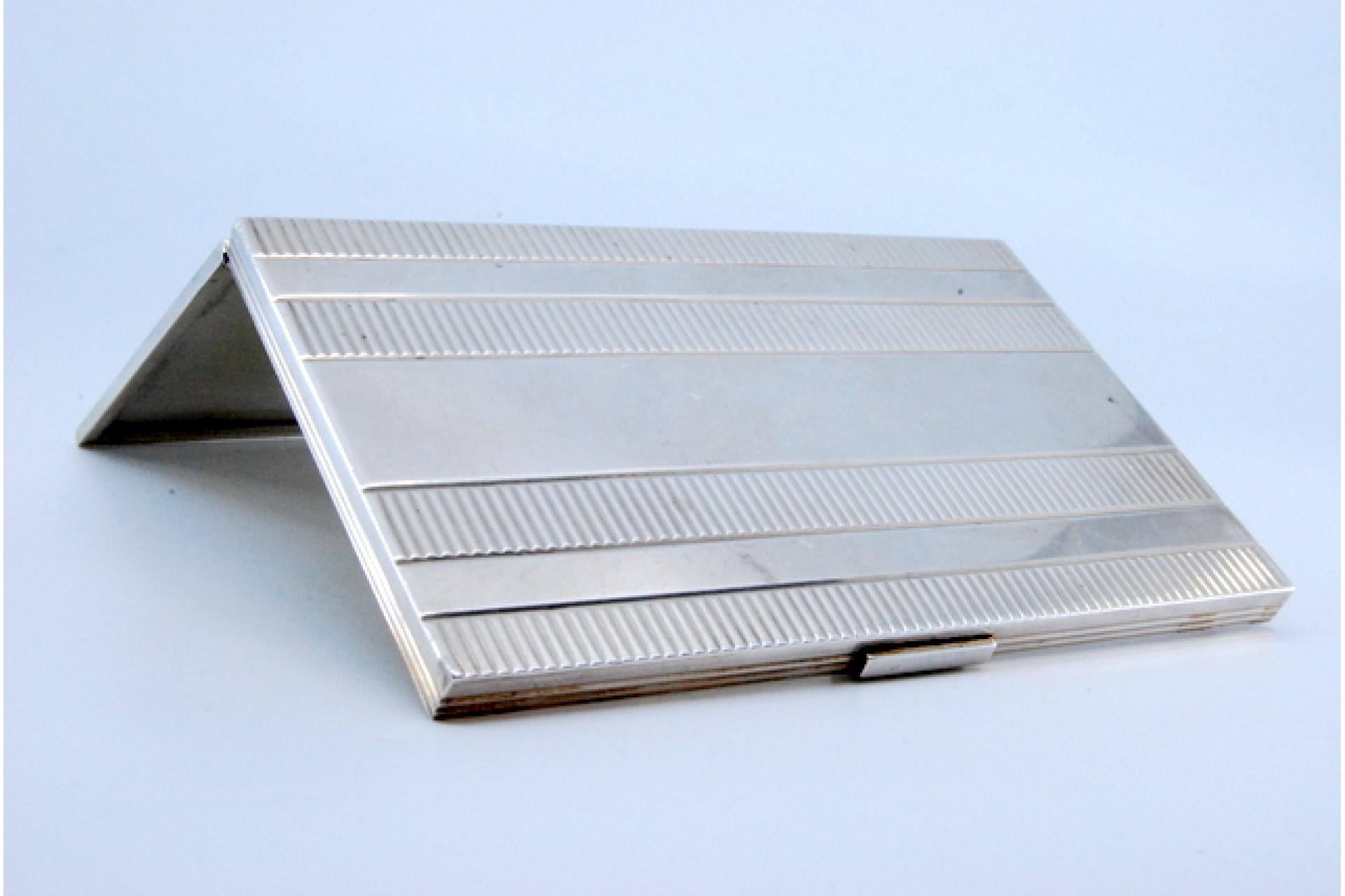 European Silver and gold case with raised bands around monogram plate, hinged lid For Sale