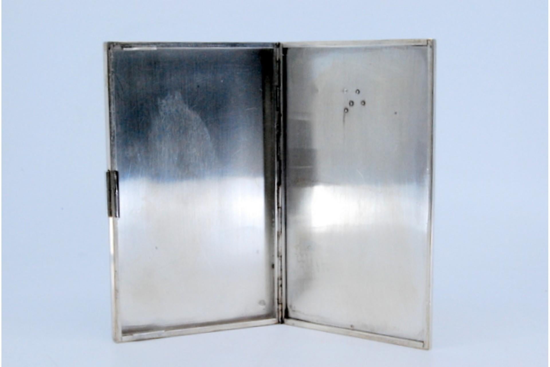 Silver and gold case with raised bands around monogram plate, hinged lid For Sale 1