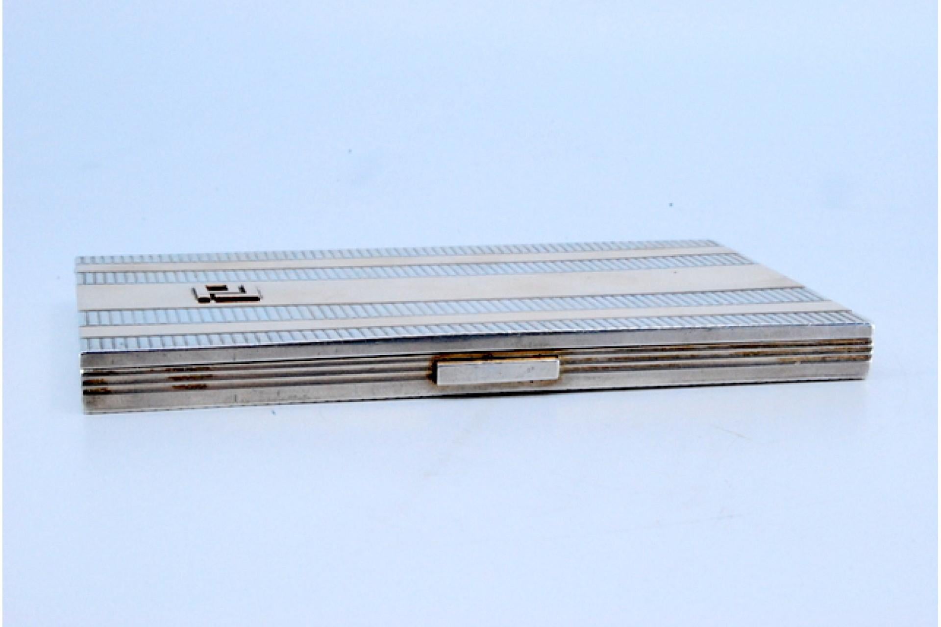 Silver and gold case with raised bands around monogram plate, hinged lid For Sale 4