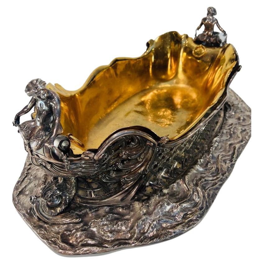 Silver and gold center piece attributed to FABERGE with two Mermen circa 1850. For Sale