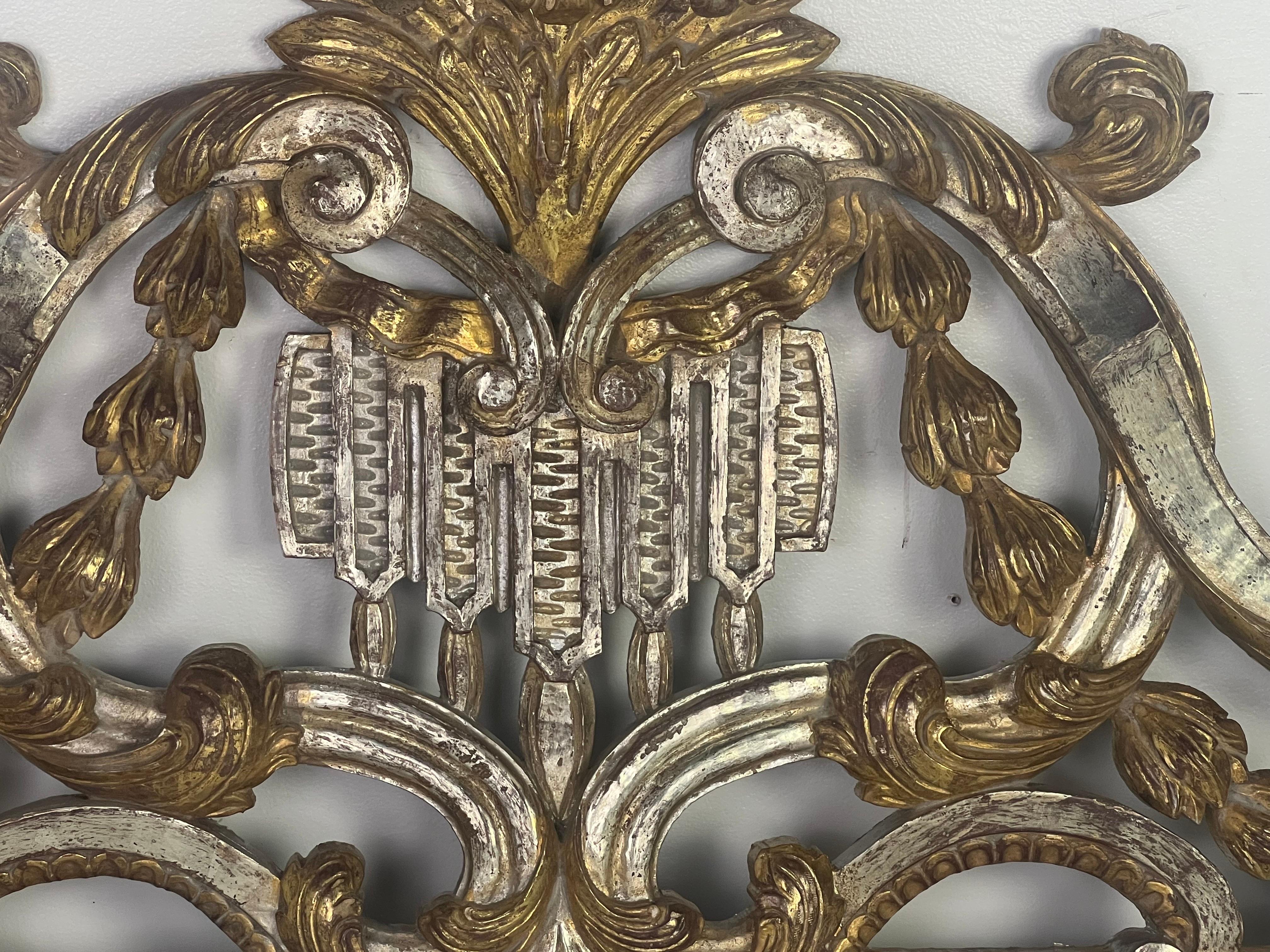 Gold Gilt and Silvered ornately carved architectural piece depicting both scrolls and acanthus leaves throughout.