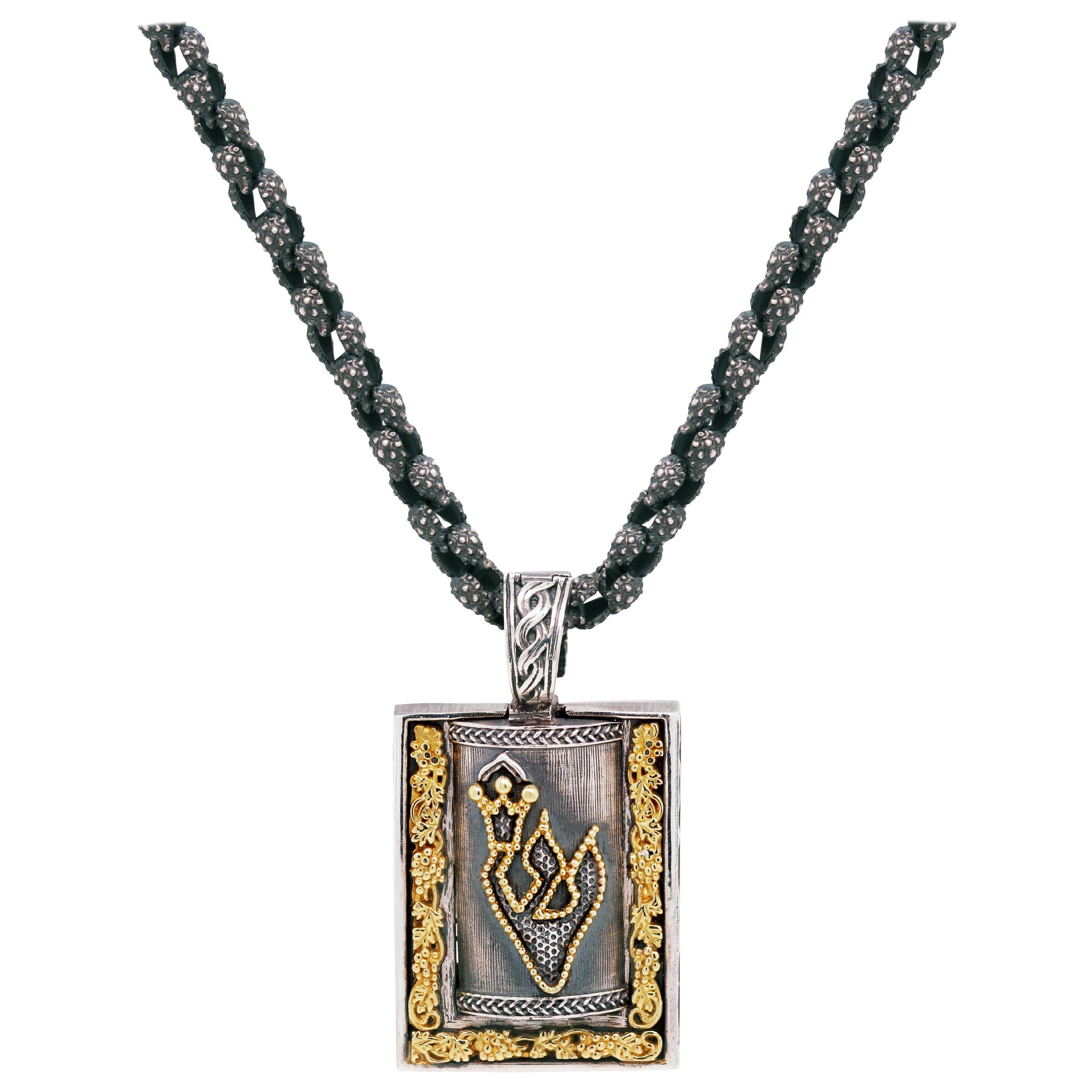Silver and Gold Jewish Mezuzah Pendant Necklace with Chain by Stambolian

Pendant is a locket that opens to store a prayer. This state-of-the-art Mezuzah is finished in the Stambolian Aged Silver, the yellow is solid 18K Gold.

Chain comes standard