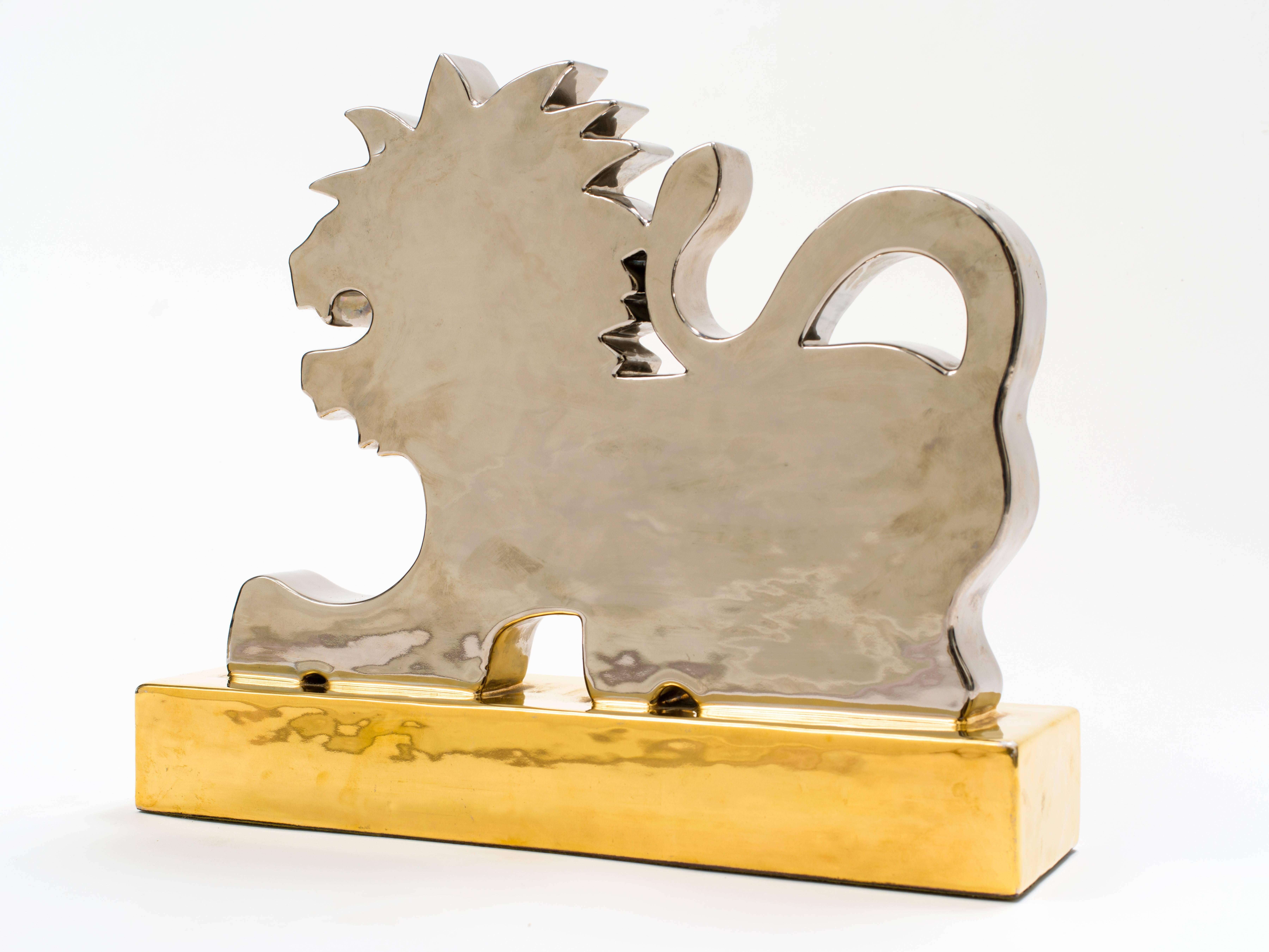 1950s silver and gold metallic ceramic lion sculpture by Italian Designer Ugo Zaccagnini. Rare and Impressive large-scale sculpture with bold metallics makes this a unique collector's piece. You just don't see too many of these from the 1950s.