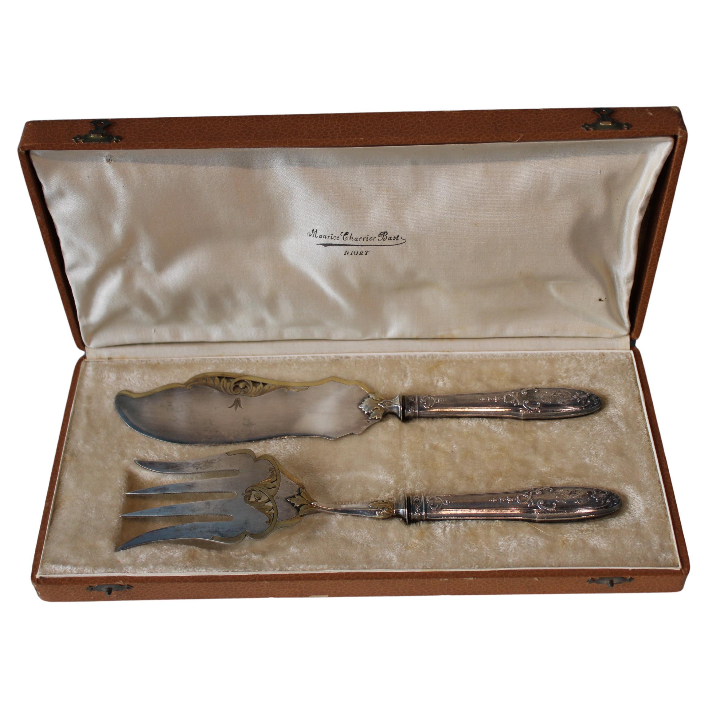 Silver and gold metal serving cutlery in their box For Sale