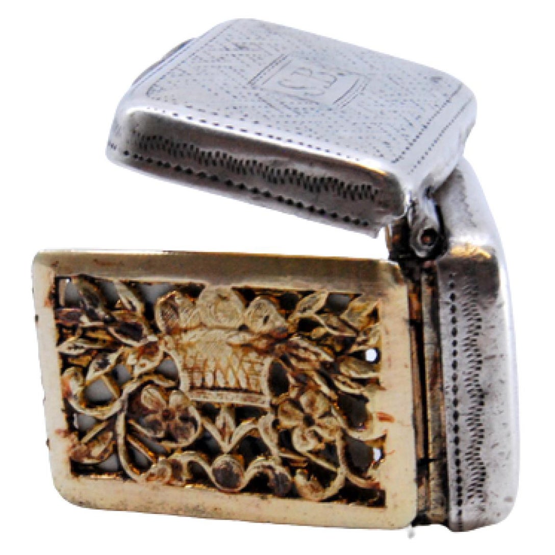 Silver and gold vinaigrette box with George III period engraving on the lid