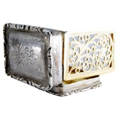 Silver and gold vinaigrette box with George IV period trim on the lid and casing