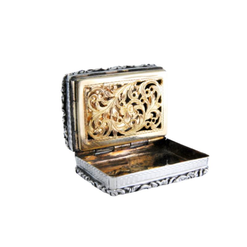 Silver and gold vinaigrette box with Victorian period trim on the lid and casing