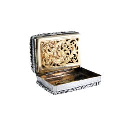 Silver and gold vinaigrette box with Victorian period trim on the lid and casing