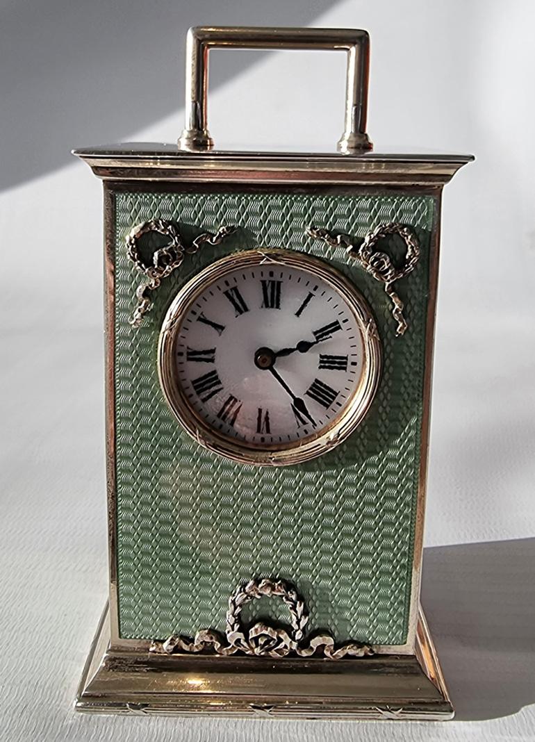 A superb silver and green guilloche enamel carriage or boudoir clock by Georg Adam Scheid in original leather case. The 8 day movement is stamped with a lion, this is the symbol of a fine and prolific French carriage clock maker by the name of