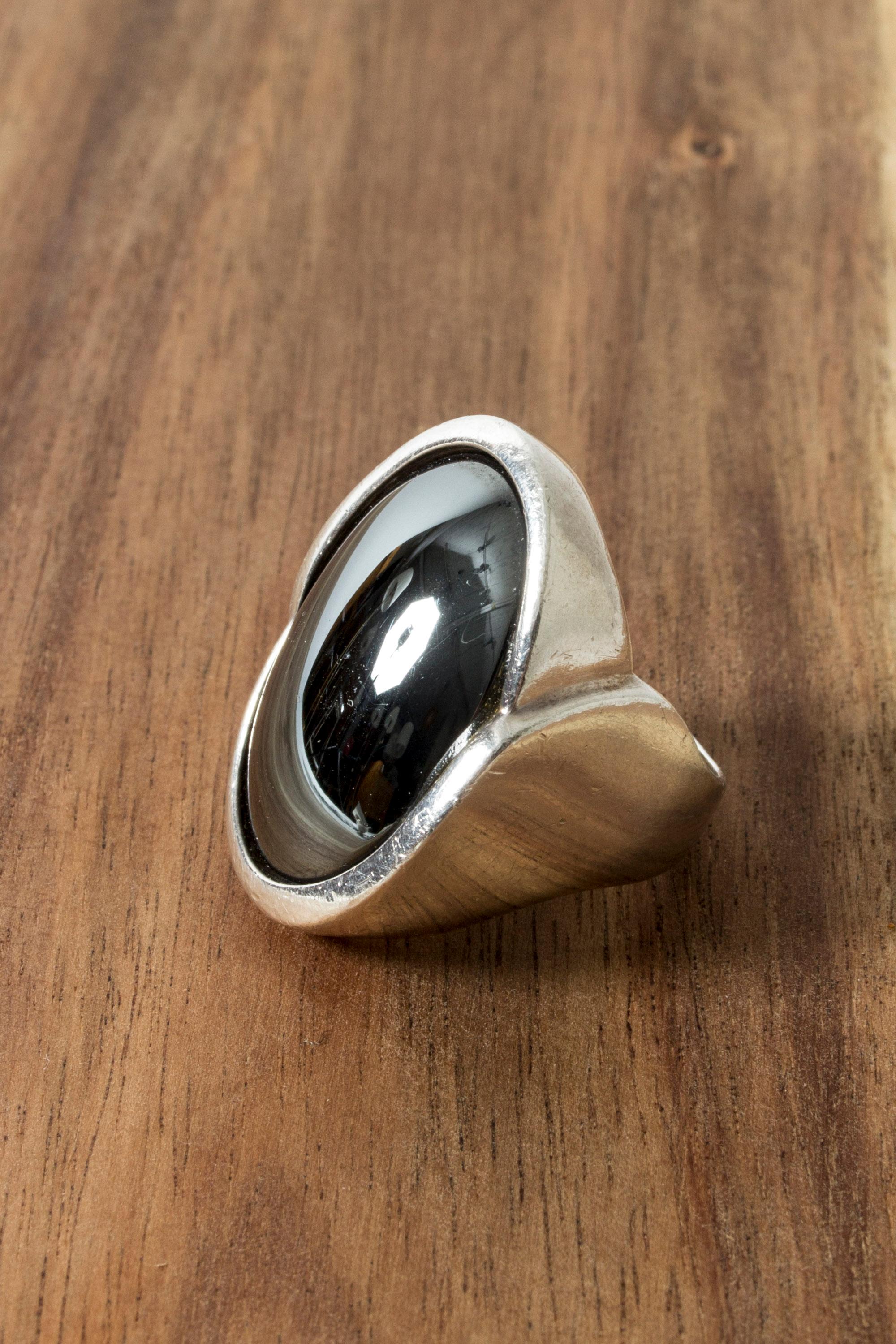 Very cool silver ring from Niels Erik From, with a large, oval hematite stone. Smooth, graphic lines, amazing metallic looking stone.