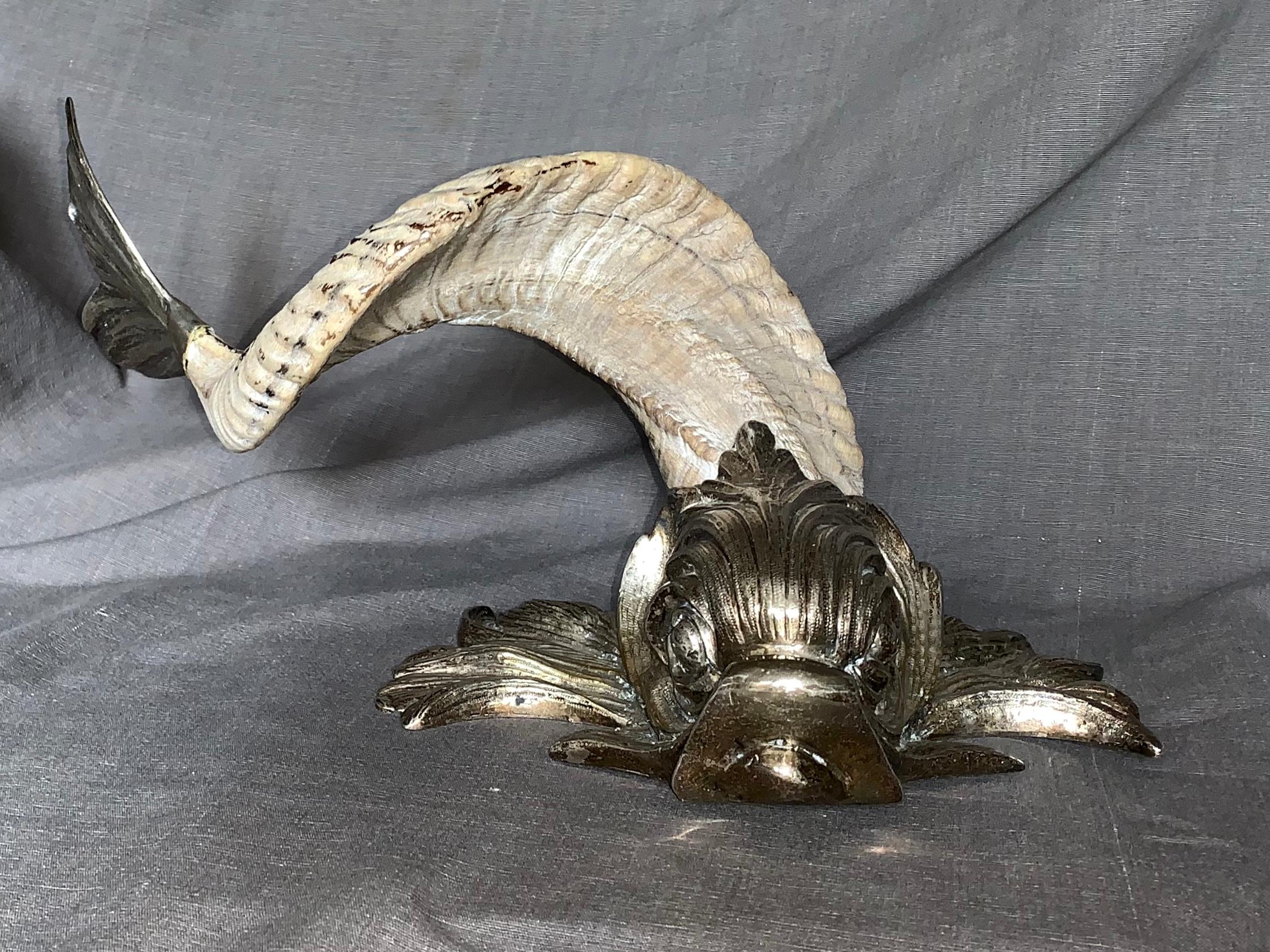 Silver and Horn dolphin by Gabriella Crespi. Tabletop dolphin in ram’s horns fitted with silver head and tail, signed, 