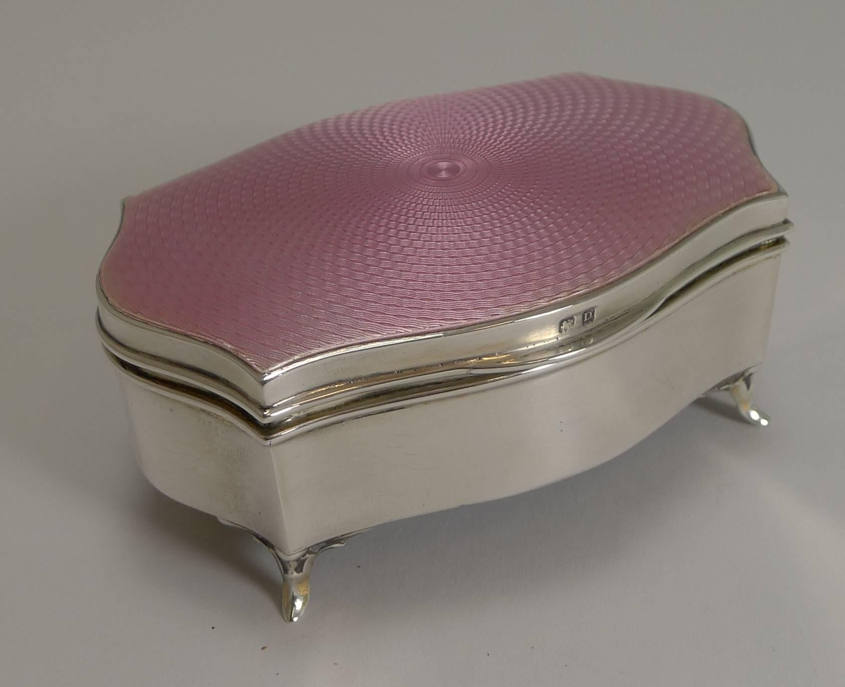 Always in high demand are these jewelry / ring boxes and even more sought-after in the most popular color, pink.

Made from English sterling silver and standing on four pretty feet, the top is covered in perfect pink guilloche enamel with a bright