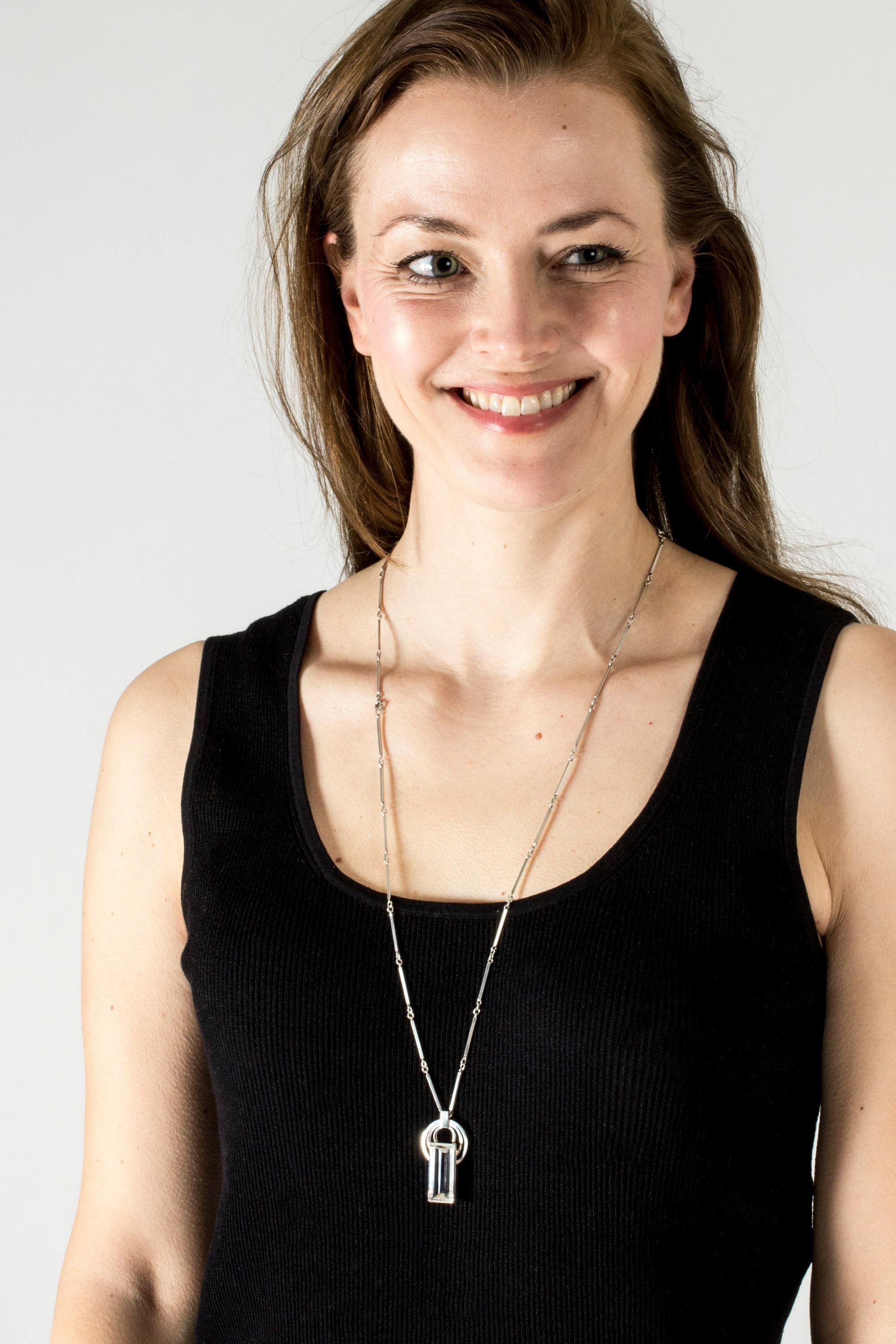 Beautiful silver necklace from Stigbert, with an elegant staff chain and rock crystal pendant. Crisp, clear stone in a baguette cut, adorned with spheres at the top. Timeless design.