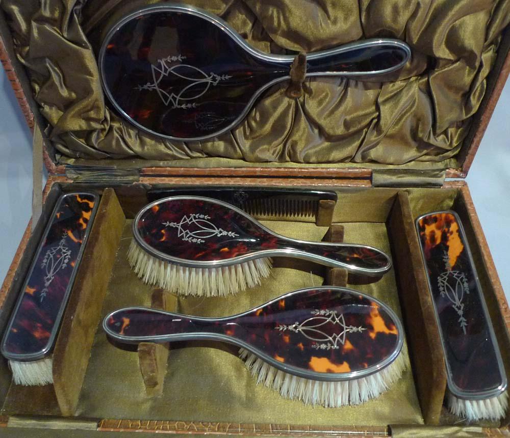 English Silver and silver pique tortoiseshell hairbrushes and hand mirror original case For Sale