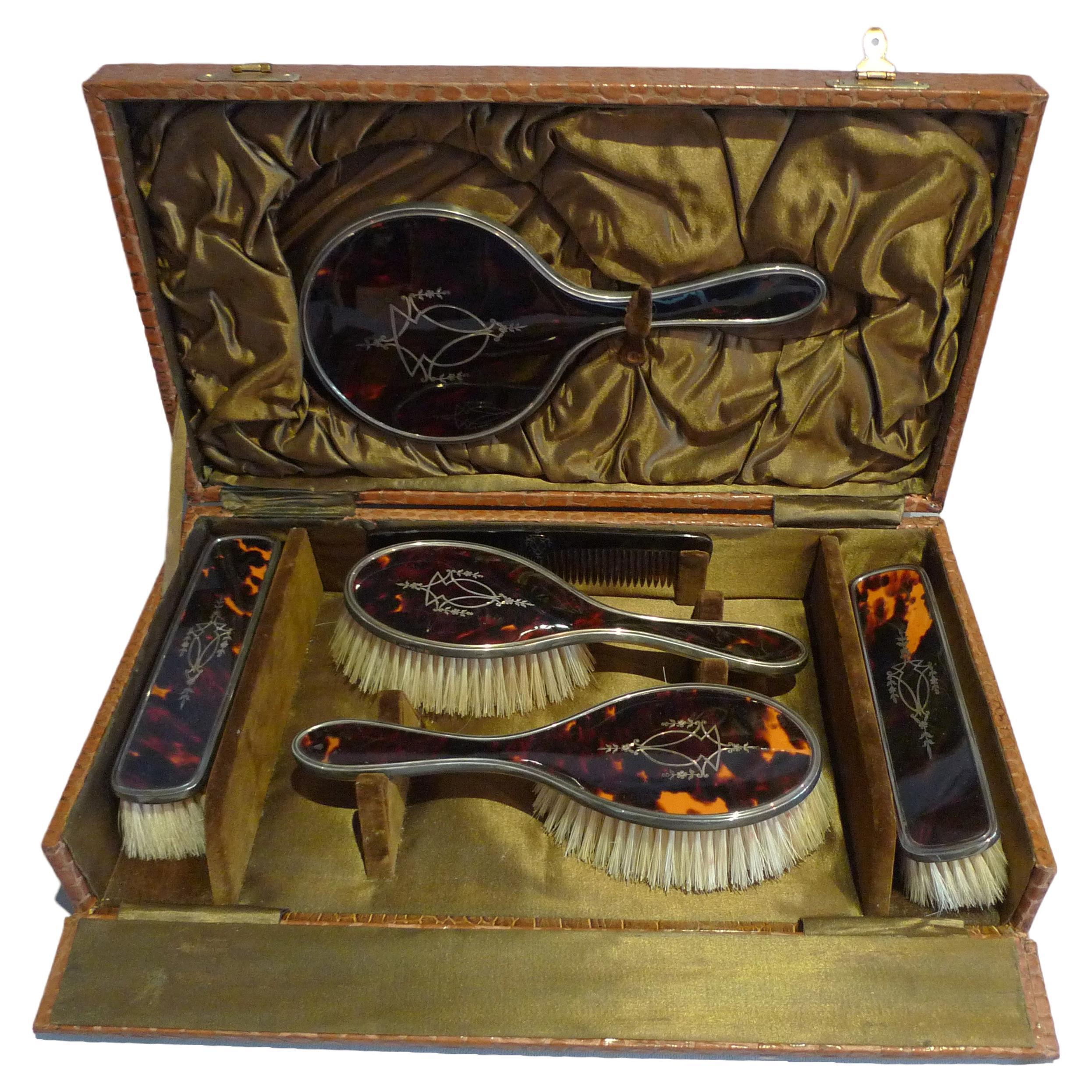 Silver and silver pique tortoiseshell hairbrushes and hand mirror original case For Sale