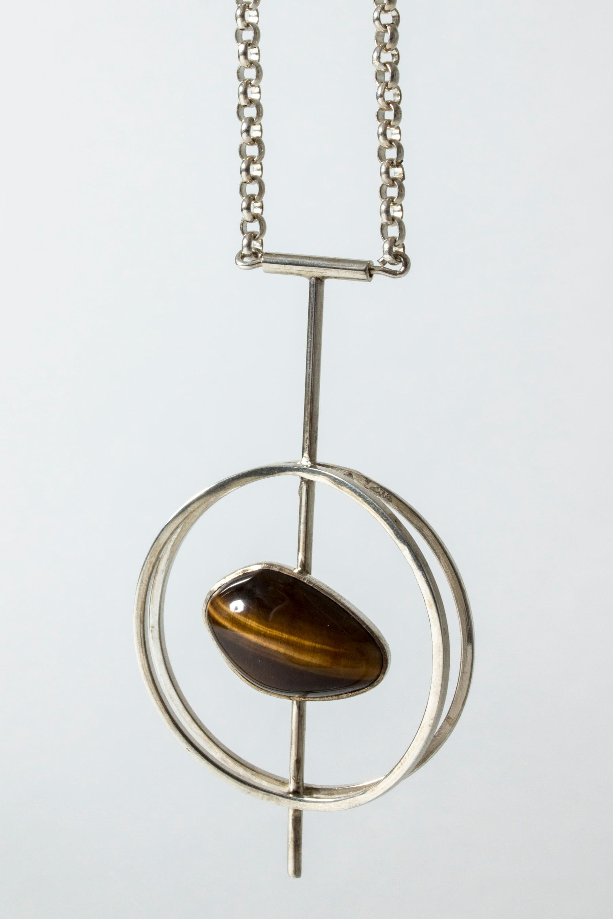 Striking silver pendant from Kaplans, with a springy spiral inside. Hypnotic design with great execution.