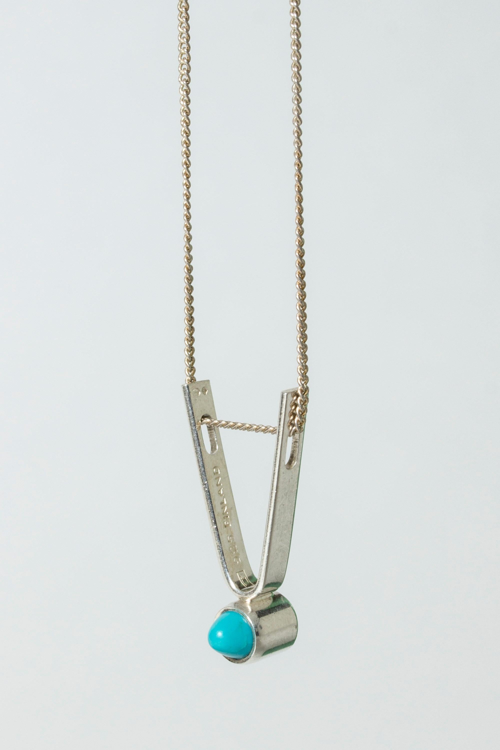 Expressive silver pendant by Elis Kauppi, with a pointy turquoise stone. A great design in a small format, easily becomes a jewelry favorite!