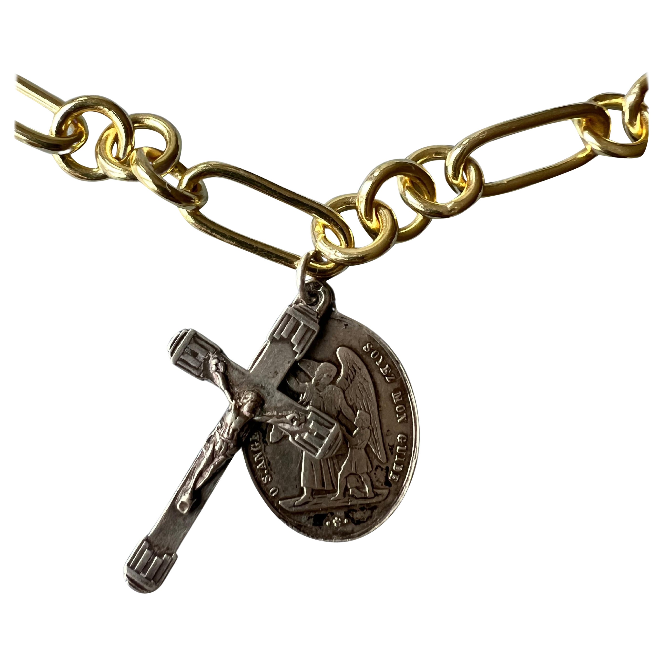 Silver Medal Cross Chain Necklace Choker Vintage

Cross and Angel Medal in Silver (Vintage) hanging on a 14k Gold Plated Chunky Chain Choker Necklace

Designer J Dauphin

Lenght: 18