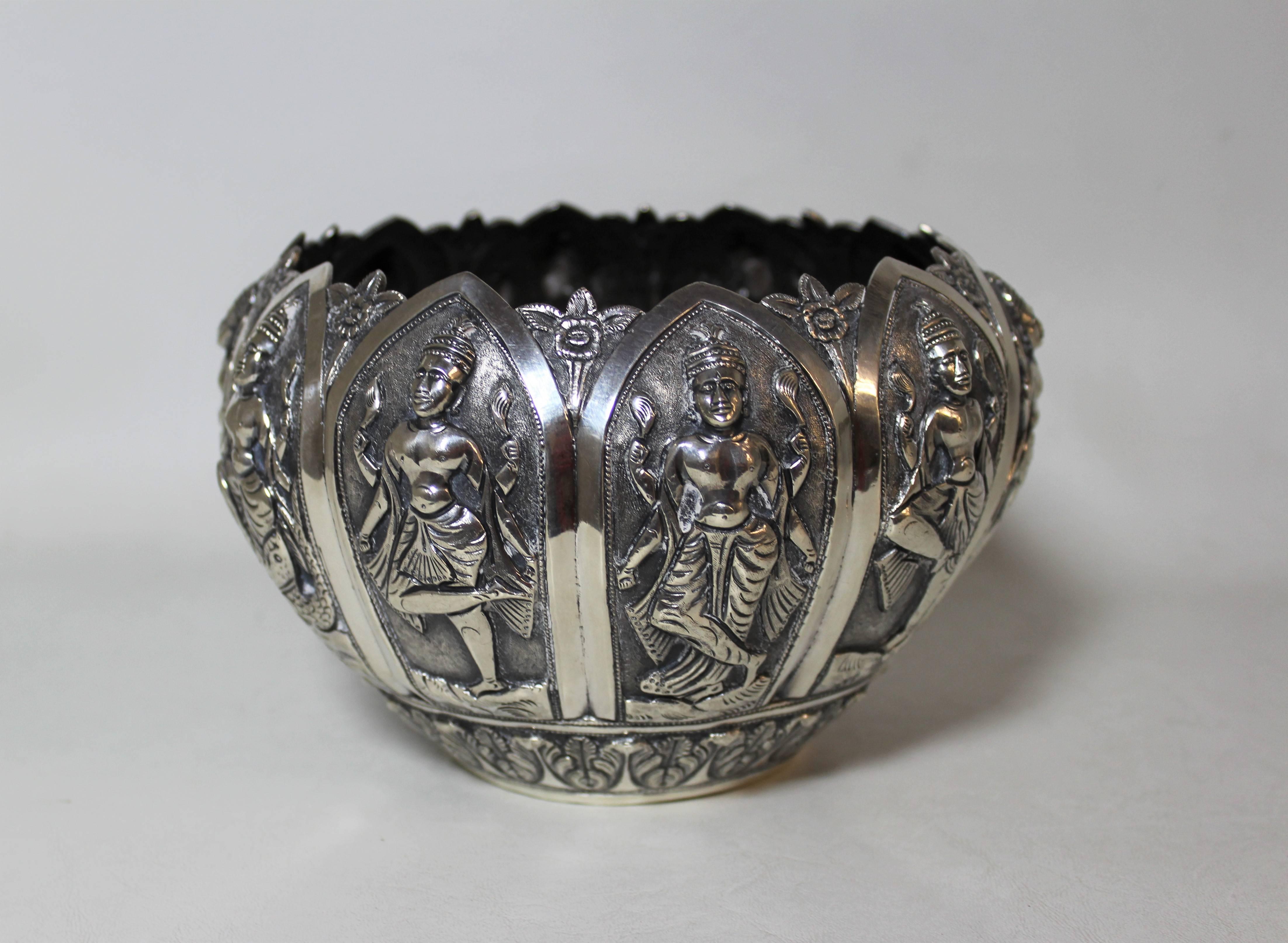Silver Anglo-Indian bowl with ten figures each featuring a different pose.