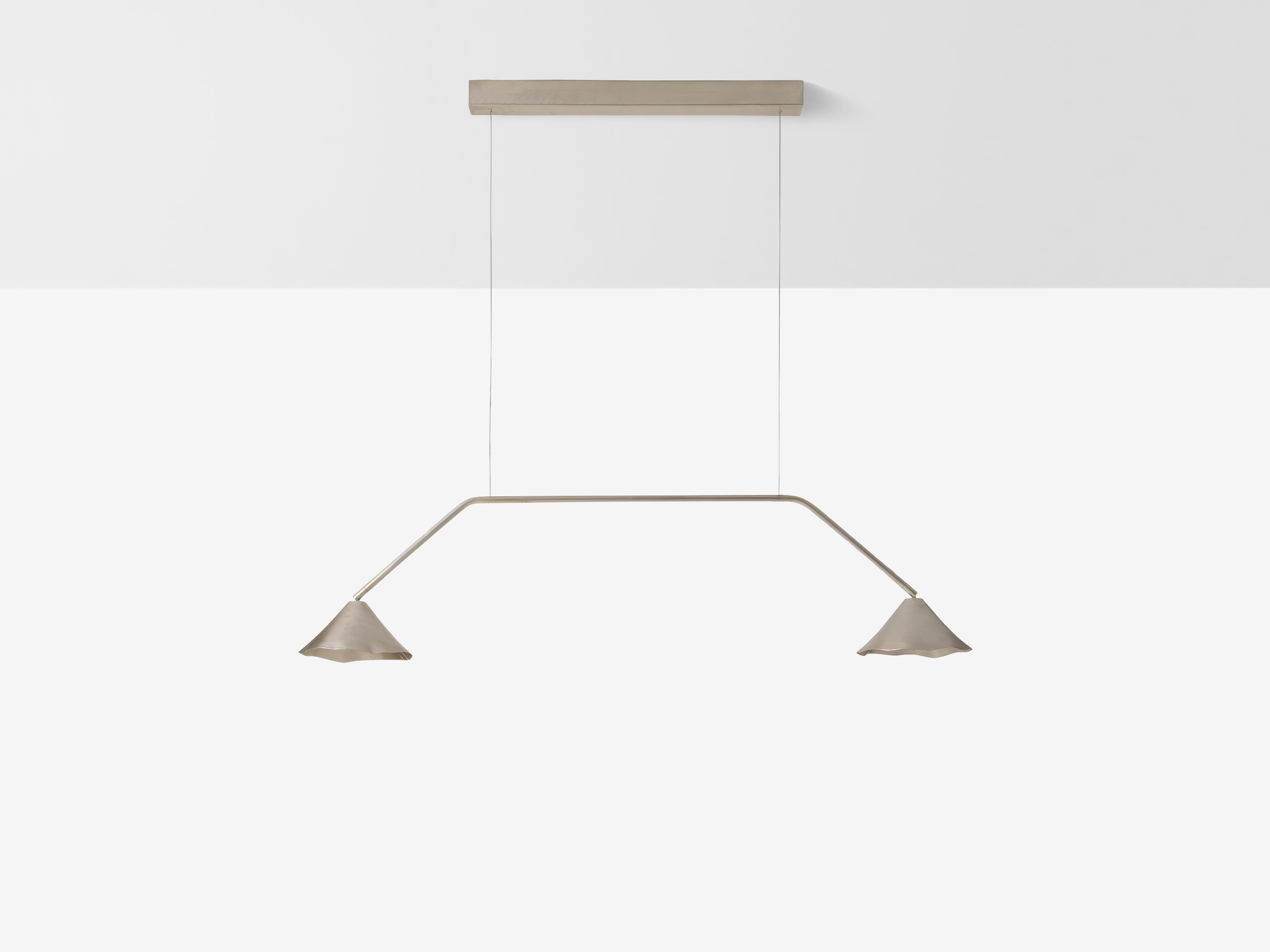 Silver Antica IV Linear Pendant by OHLA STUDIO
Dimensions: D 25 x W 145 x H 26 cm 
Materials: Copper.
5 kg

Available in other finishes: Silver, Forest, and Teal.

A pre-Hispanic smithing tradition thrives by recycling copper scraps into