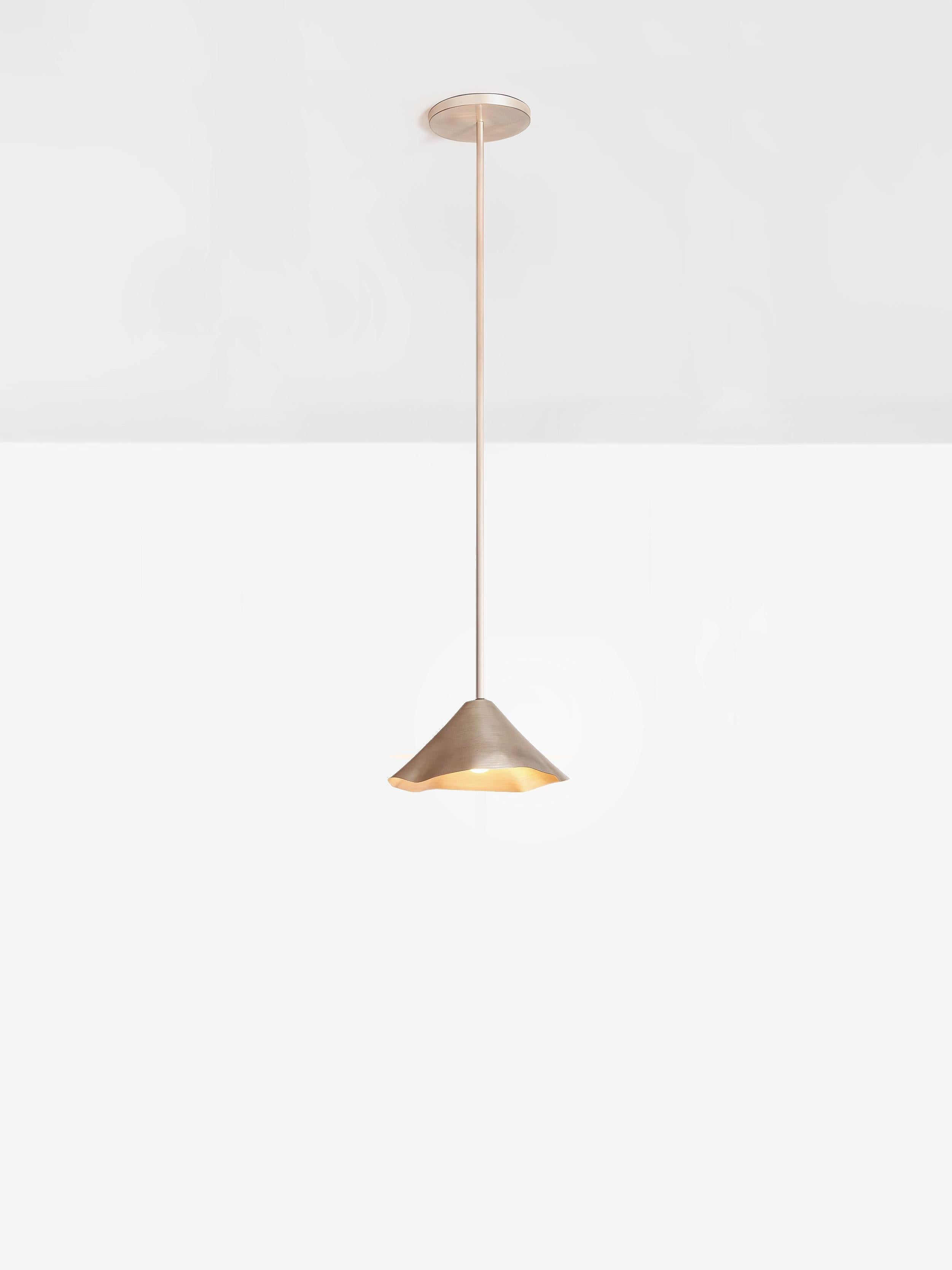 Silver Antica VIII Single Pendant by OHLA STUDIO
Dimensions: D 40 x W 40 x H 150 cm 
Materials: Copper.
5 kg

Available in other finishes: Silver, Forest, and Teal.

A pre-Hispanic smithing tradition thrives by recycling copper scraps into