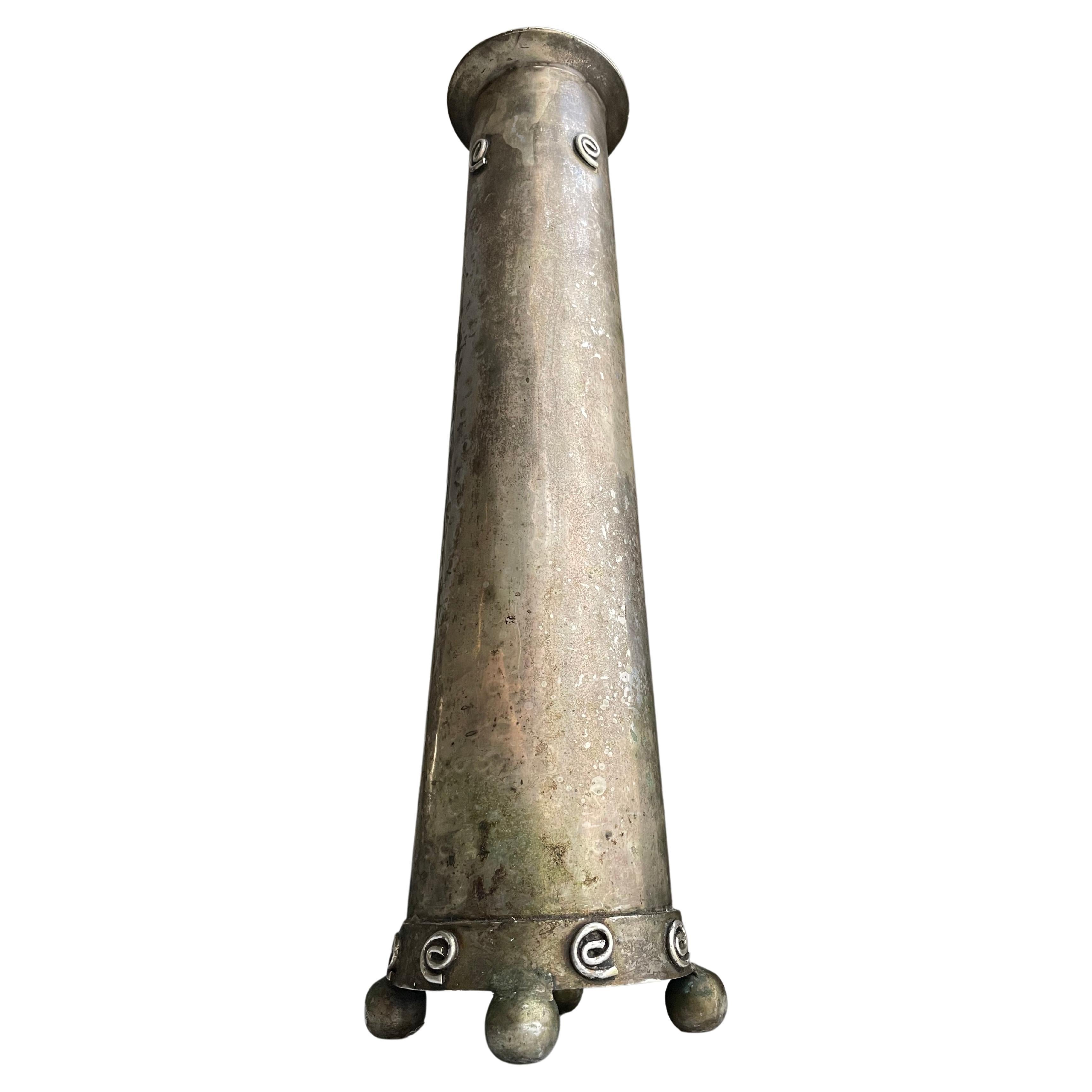 Antique silver patinated incense tower with spiral details on top and bottom. The tower sits atop ball feet for good circulation. 

This incense tower is made for burning incense cones on charcoal - a beautiful sight. It can be used for incense,