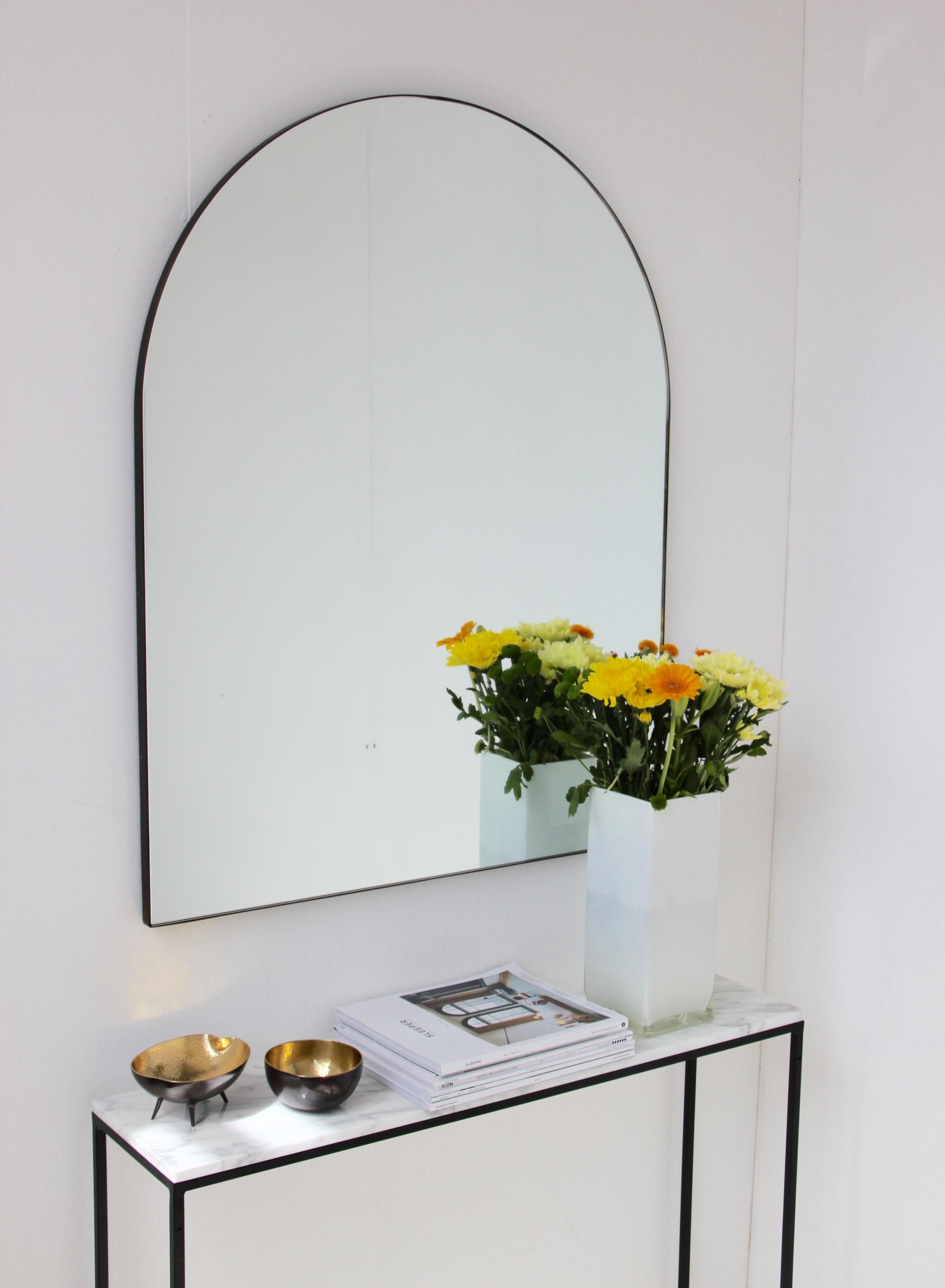 Delightful contemporary arched mirror with a brass patina frame. Designed and handcrafted in London, UK.

Dimensions: W 75 x H 95 x D 1.8cm / w 29.5'' x h 37.4'' x d 0.7'', or any bespoke size.

Medium, large and extra-large (37cm x 56cm, 46cm x