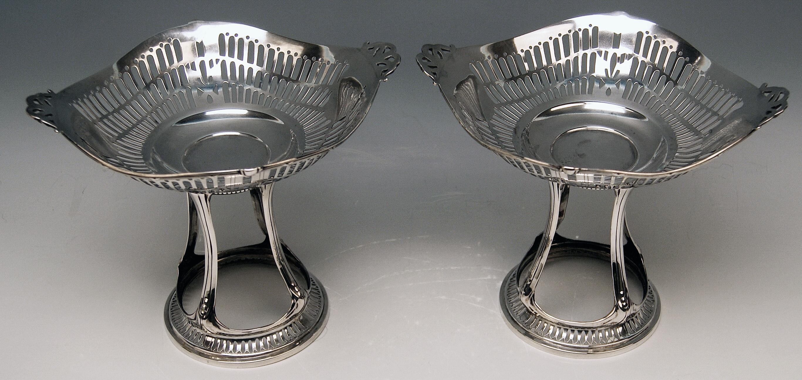 Silver German pair of centrepieces / centerpieces made by Bruckmann & Sons (Germany).

Art Nouveau (made circa 1900)
Silver 800
branded by German Crescent with Crown
Manufactory: 
Eagle Mark of Bruckmann & Soehne (= SONS), Heilbronn (Germany)