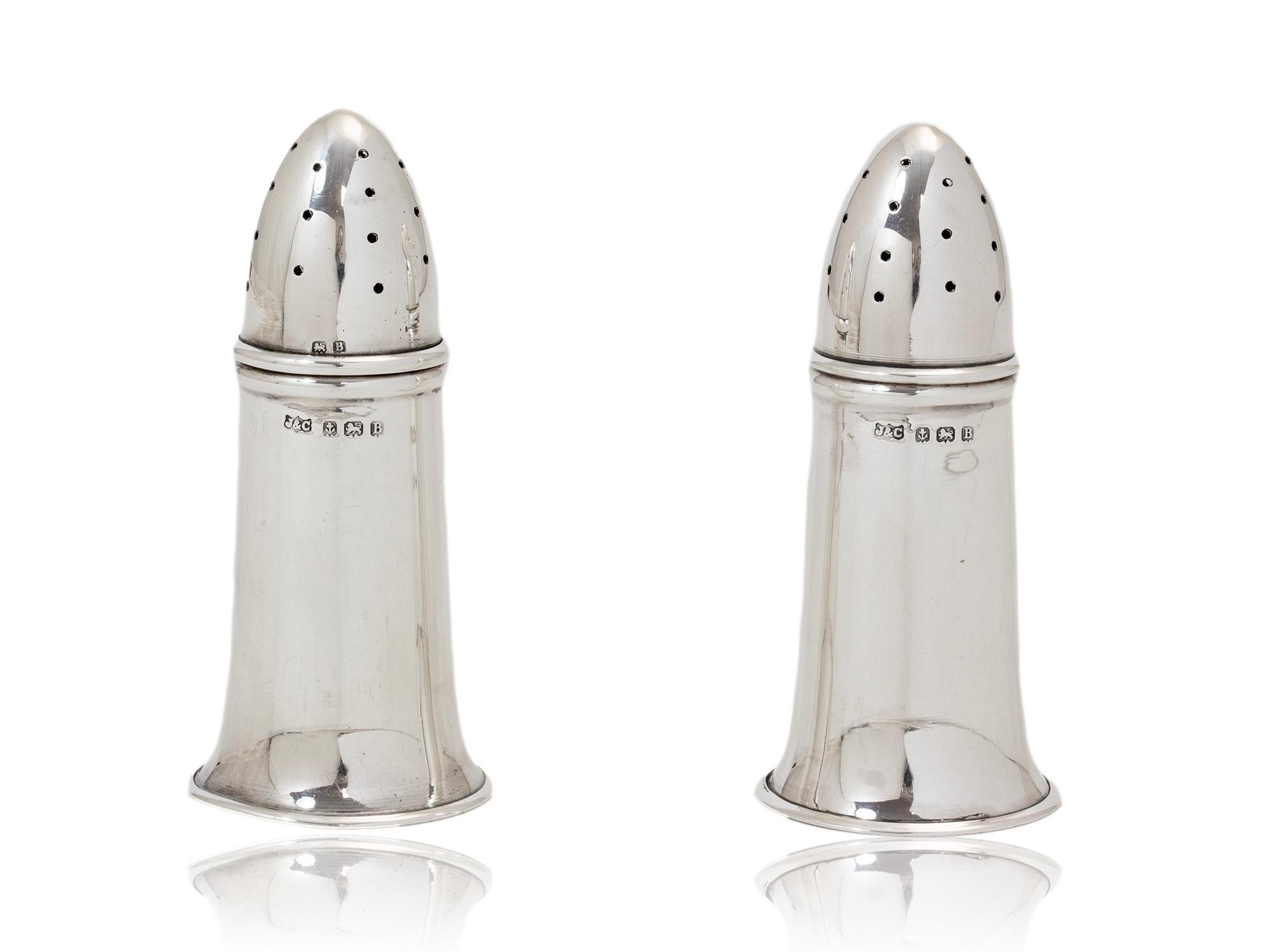 Art Deco Sterling Silver 

The Shakers cast from Sterling Silver with removable lids modelled as a pair of artillery shells. Each shell is hallmarked Jones & Crompton, Birmingham, 1926.

Sterling Silver is an alloy composed by weight of 92.5% silver