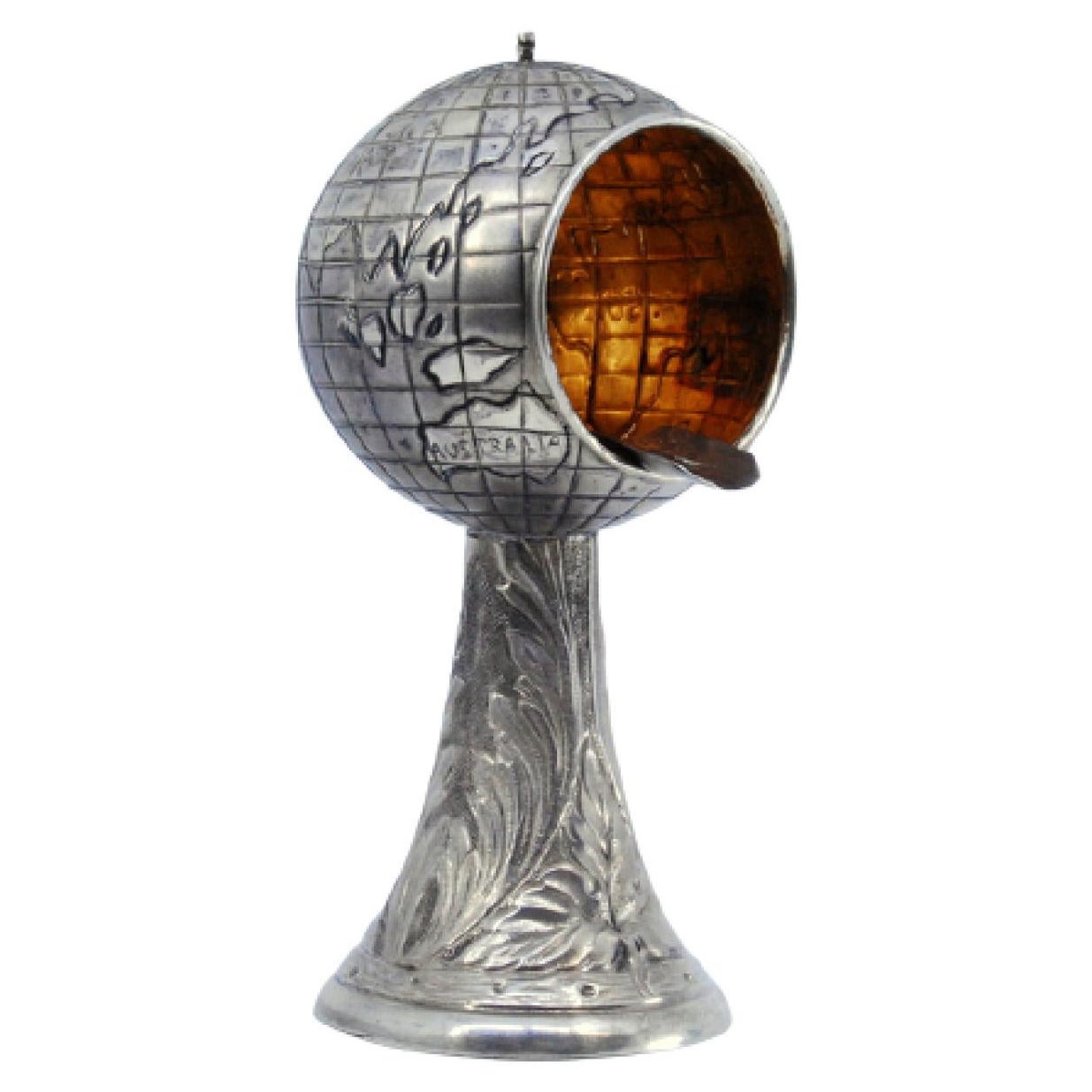 Silver ashtray in the shape of a globe w/ flowers
palms engraved on the column