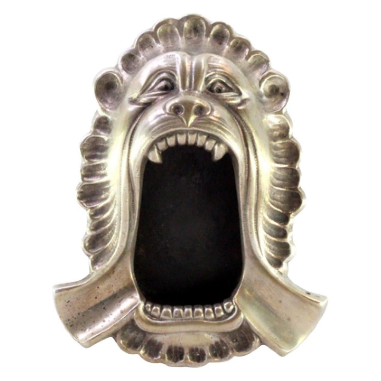 Silver ashtray in the shape of a lion
s mouth w/ reliefs 
two cigarette holders For Sale
