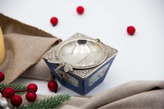 Silver ashtray with bee-form opening and ceramic insert with raised elements