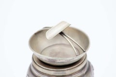 Silver ashtray with cigarette holder