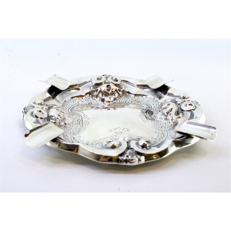 European Silver ashtray with reliefs and engravings, four cigarette holders For Sale