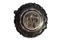 Silver ashtray with S. Miguel caravel relief in center and two rests