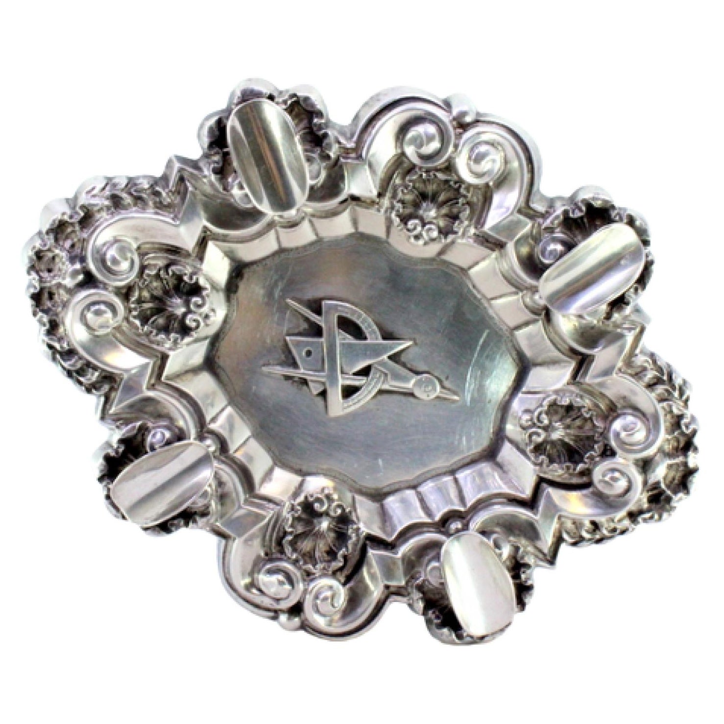Silver ashtray with shells, reliefs, four rests, and Masonic symbol