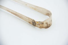 Silver asparagus or salad tongs with reliefs depicting asparagus