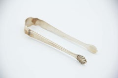 Silver asparagus or salad tongs with reliefs depicting asparagus