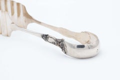 Silver asparagus or salad tongs with reliefs on the handle