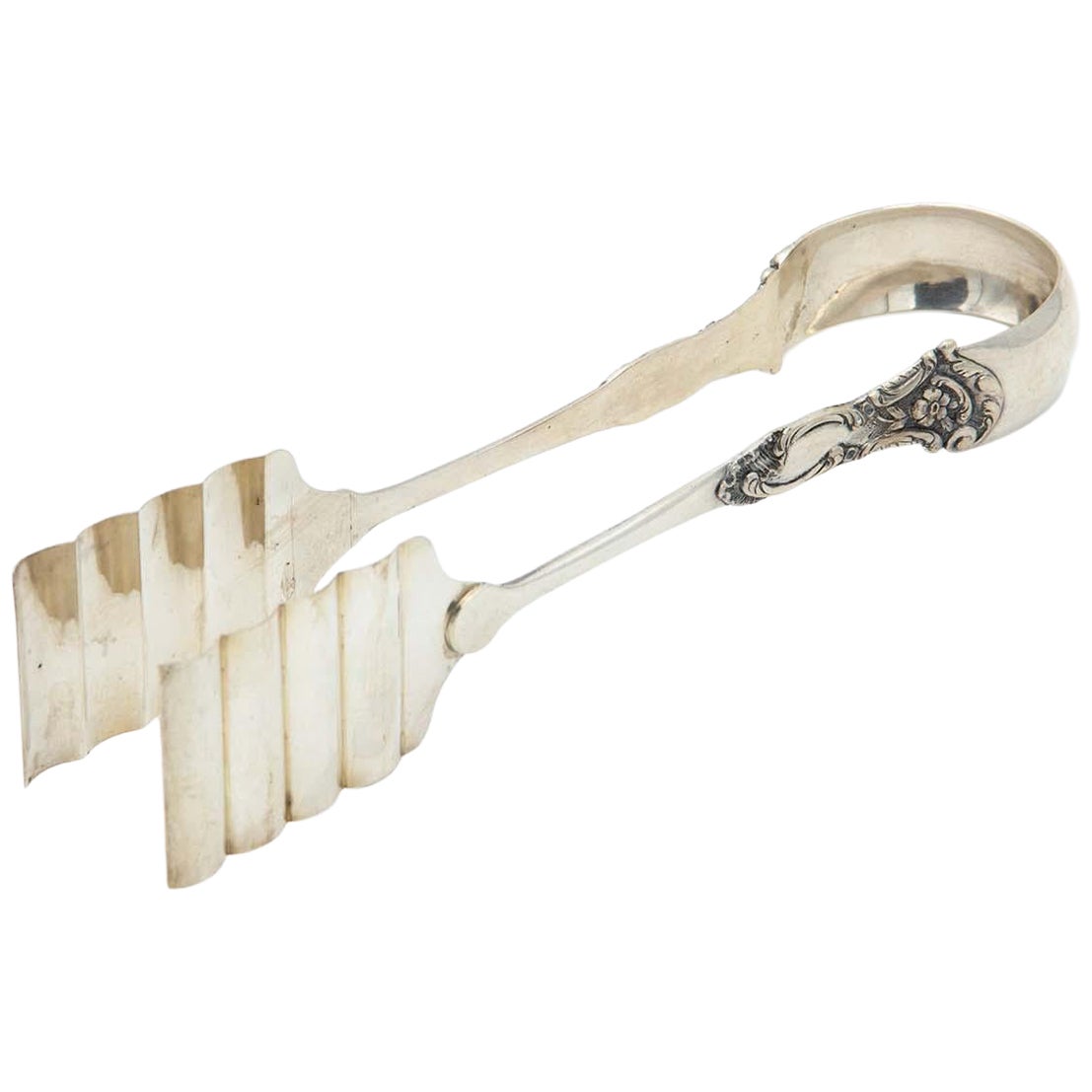 Silver asparagus or salad tongs with reliefs on the handle